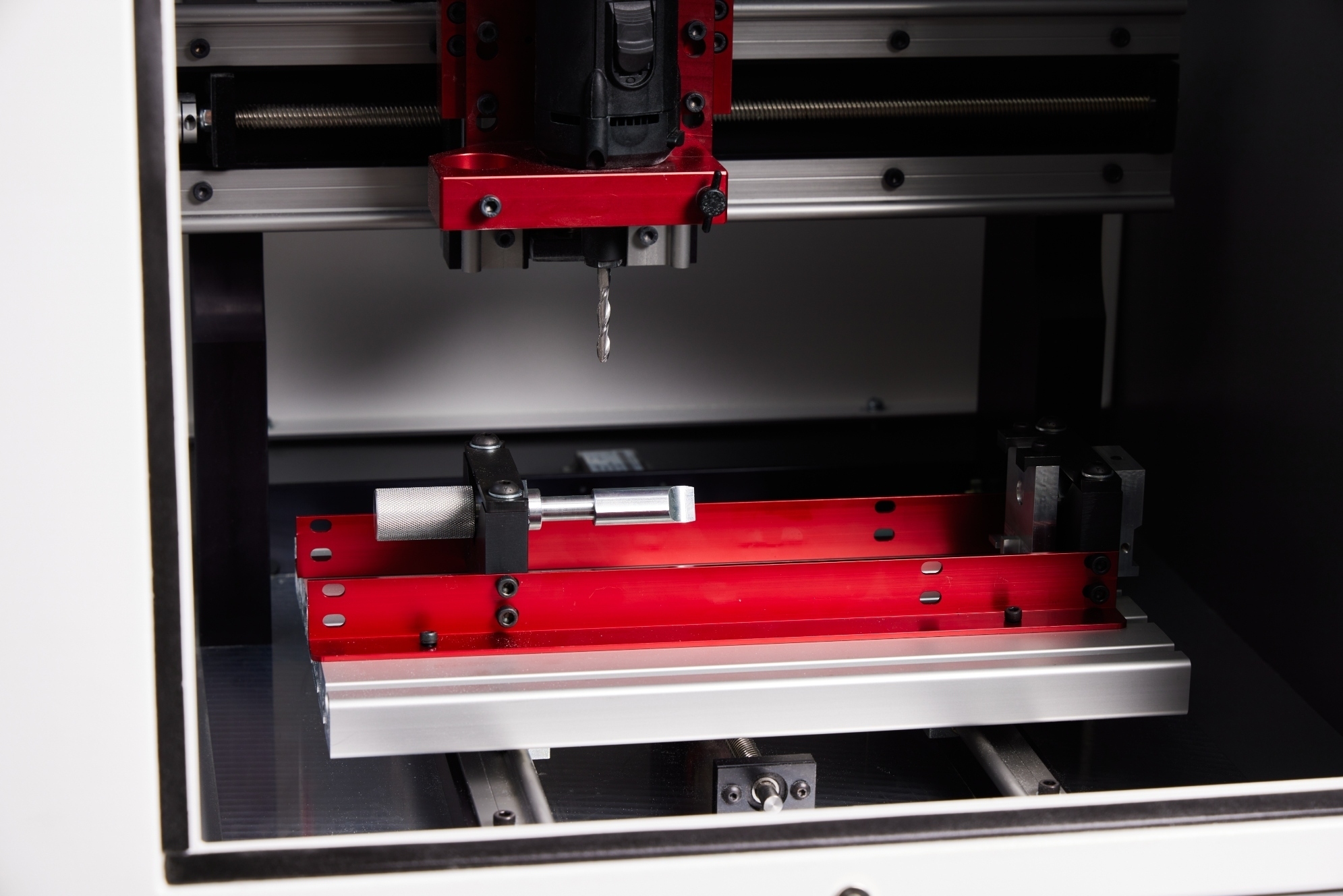 Compact 1000 work holding fixture and material positioned beneath the spindle